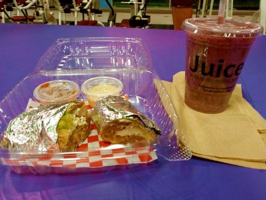 A pure life egg wrap w/swiss cheese & avocado, turkey sausage. W/salsa & chipotle sauce & a power lift smoothie! Yum!