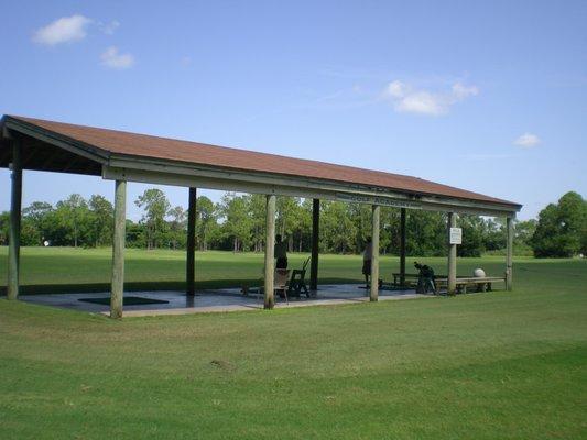 Lighted Practice range with three covered hitting stations, and Fifty  real grass tees.