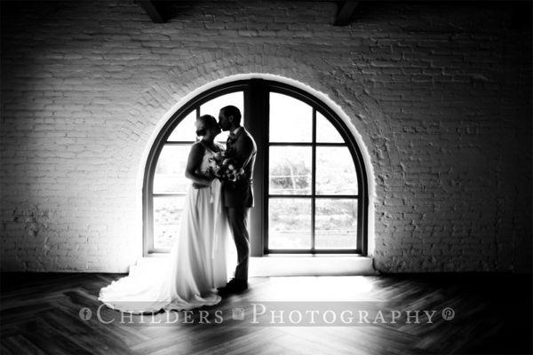 Dramatic couple in window.