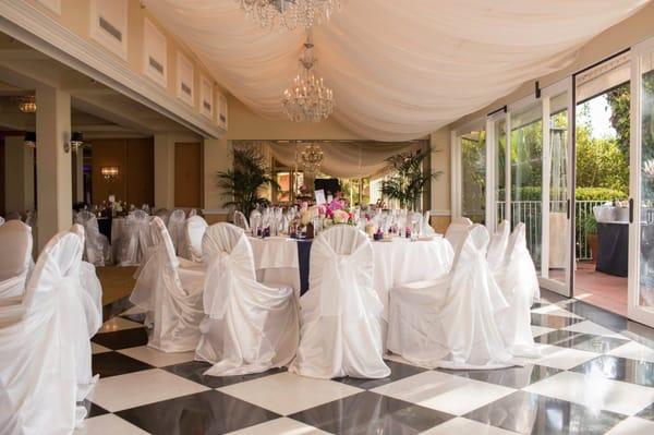 White chair covers with white sashes