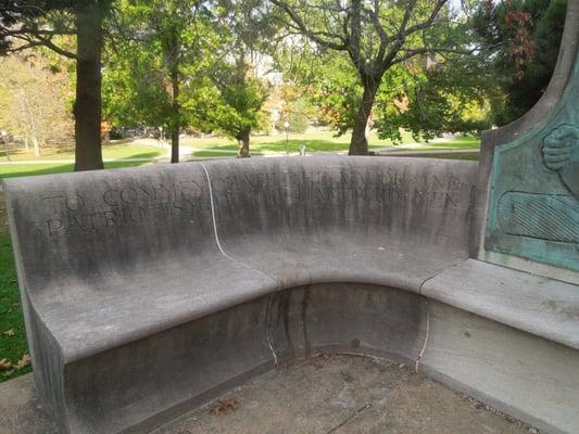 Bench with obscured and soiled dedication