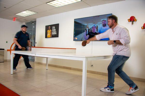 The ping pong table in the sales office gets a lot of use between calls.