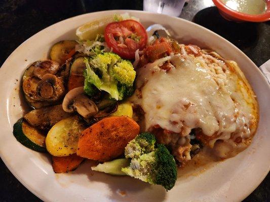 Chile relleno with ground beef and Ranchero salsa. Grilled vegetables instead of rice and beans. So good!