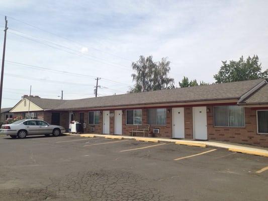 Unassuming and simple exterior. Lovely potted flowers and benches! The owners care about their place!