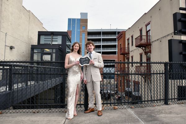 A group of young people wearing prom formalwear