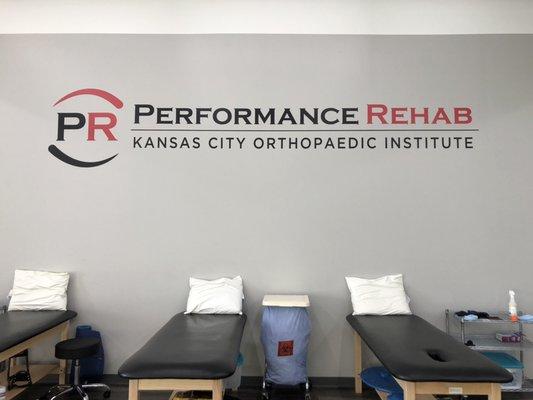 The Performance Rehab Olathe clinic offers an open concept treatment space complete with turf and top of the line equipment.