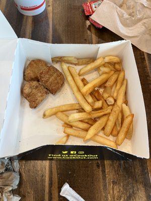 Tray of chicken nuggets and fries