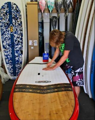 Check out he paddle room with Over 50 Boards in stock.