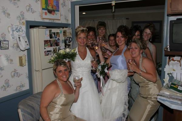 Bride to be along with her Wedding Maid of Honor and Bridesmaids having a Celebration Drink at home before Wedding Ceremony.