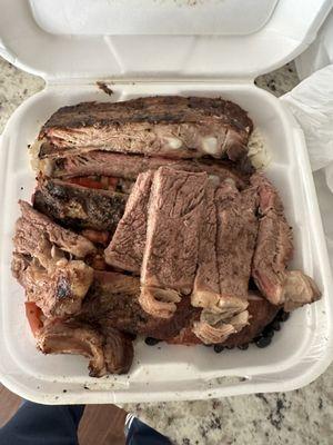 Ribs and steak.  Side of rice and beans