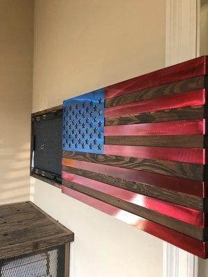 The American cabinet. Stained old cypress box with steel powdercoated flag