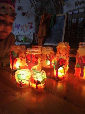 Our children made Fall candle holders by pasting tissue paper to jars they brought from home #finemotorskills