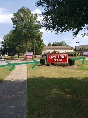 The entrance to Mission Court is by the big red Crye-Leike Plaza sign