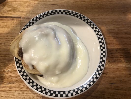 Desert- cinnamon roll with glaze. Slightly warmed.