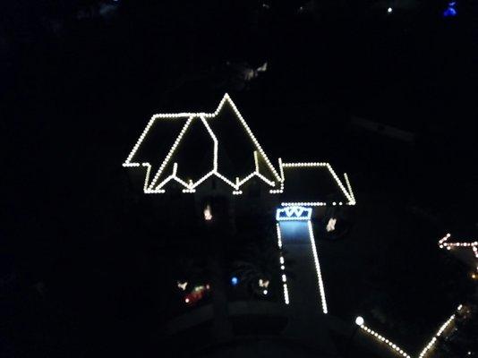 Holiday lighting on roof, ridges, gate and driveway!