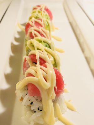 Raw sushi Roll with tuna and avocado on the top