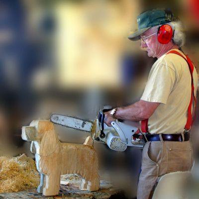 Dog carvings are made in the studio building at Dog Bark Park.  Many breeds are available.