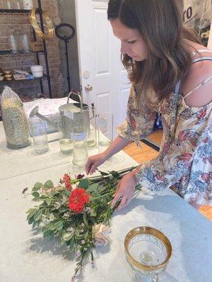 arranging her bouquet