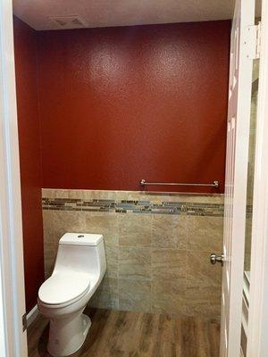 They did the wall tile with the decorative strip here. We paired it with a deep berry paint and it turned out great!