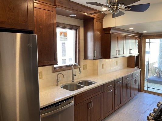 Cherry kitchen with subway backsplash