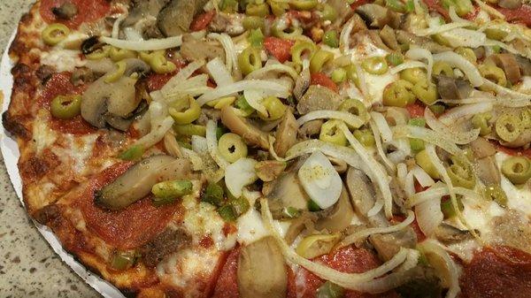 Deluxe, lots of toppings and crispy crust