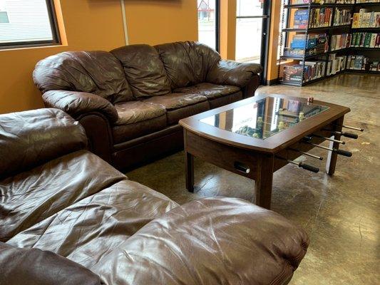 Couch seating area and foosball table