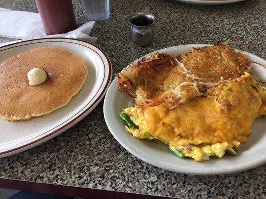 Denver omelette with hash browns and one pancake.