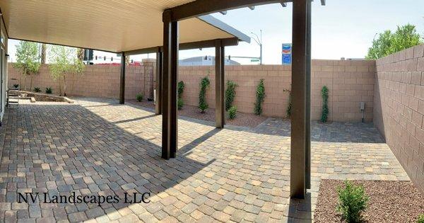 Large patio with a patio cover for entertaining guests.