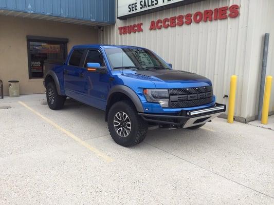 2013 ford raptor you see when ever you pass our shop sporting a NFab front bumper with a ridged 50" light bar