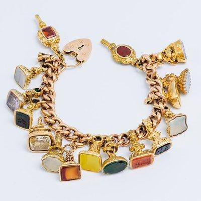 selectantiquejewelryVicto­rian Charm Bracelet with Hard Stone Intaglio. Circa - 1850's