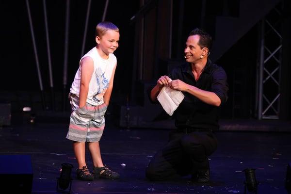 Welk Illusions 2016.  Anthony performing snow with young audience guest.