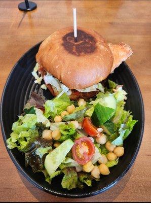 Fried chicken sandwich with a beautiful light salad