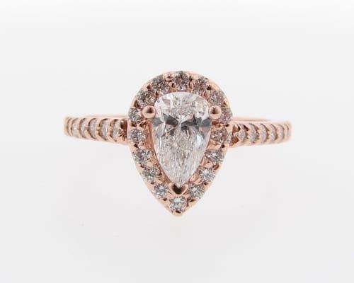 Ooh!  Pink gold/rose gold and a pear shape diamond.