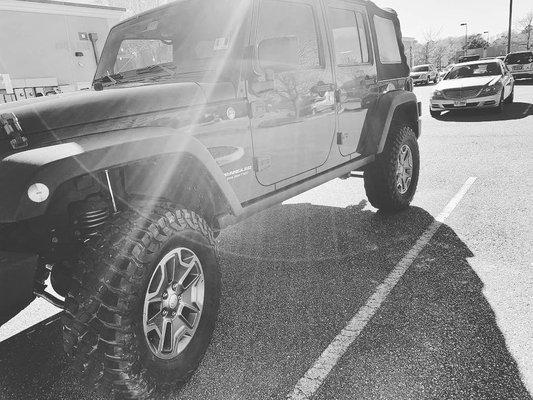 2014 Jeep Rubicon with a 3 1/4 lift, km3 MT tires and 2 inch spacers