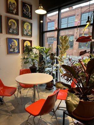 Indoor seating with local art on display on the wall!