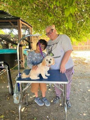 AFTER Pic of my son, his dog Canelo, and Candace(the groomer). What a difference! Canelo looks amazing!!