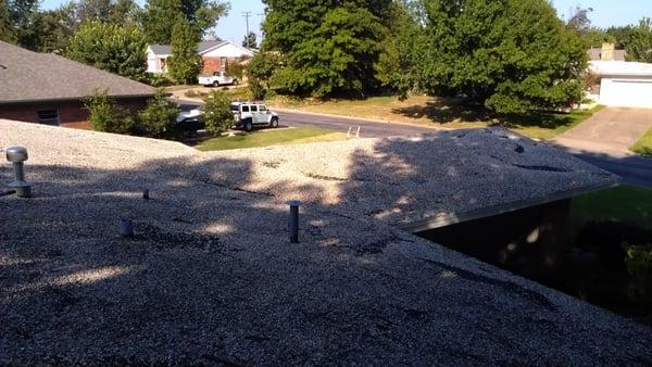 Project - Behre...Residential house with a low slope gravel roof...