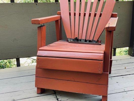 The chair on the privet deck is broken and rotted.