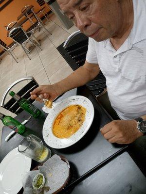 Daddy loving his lasagna