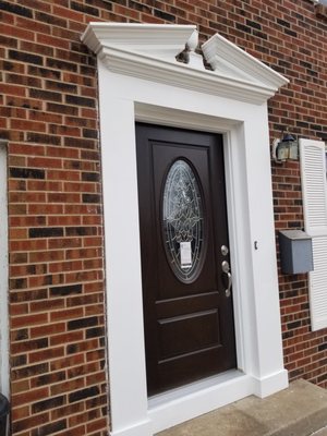 Entry door surround with stacked trim above!