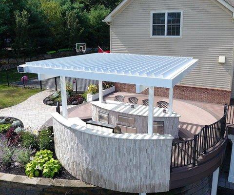 Louvered roof over outdoor kitchen