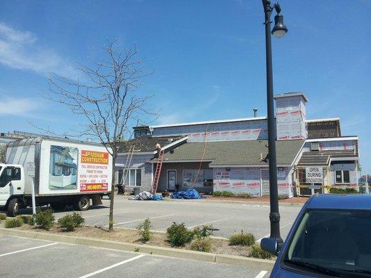 Here we are replacing the roof at Pier Marketplace in Narragansett, RI.