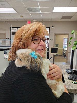 Our Ms. Robin with Harley, a regular visitor at AFCU.