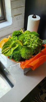 Packaged to carry in the car, so you can't see the nice square vase.  Very cool arrangement.