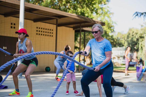 Karen McCabe rocking the ropes during our 4th of July fundraiser and workout at Graceada Park.