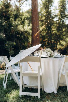 Table setting with parasol. Table and chairs provided by The Old Homestead.