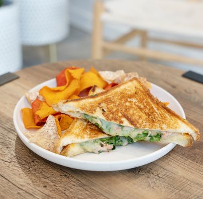 Grilled ham and cheese and spinach sandwich