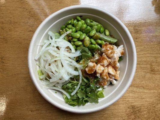 Spicy Ginger Chicken Poké Bowl. Sushi rice, spring mix, chicken, sweet onion, edamame, cilantro, sesame, spicy ginger sauce.