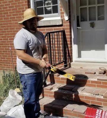 Tristan Layman working on some brick steps