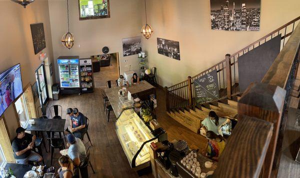 Inside of restaurant with downstairs and upstairs sitting.